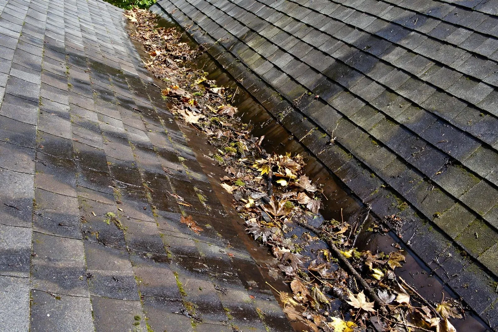 A debris-filled valley found during a roof inspection in Sayreville, NJ